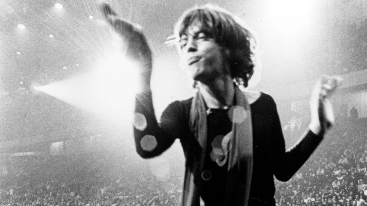 Mick Jagger in a scarf on stage